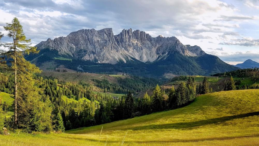 Majestic Peaks of Latemar's Natural Beauty wallpaper