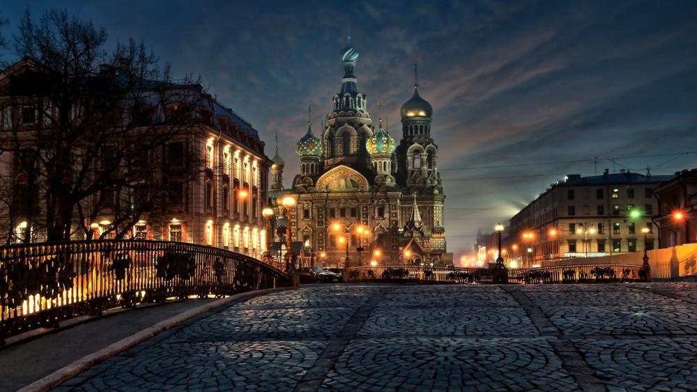 Enchanting Cityscape of St. Petersburg's Illuminated Cathedral wallpaper