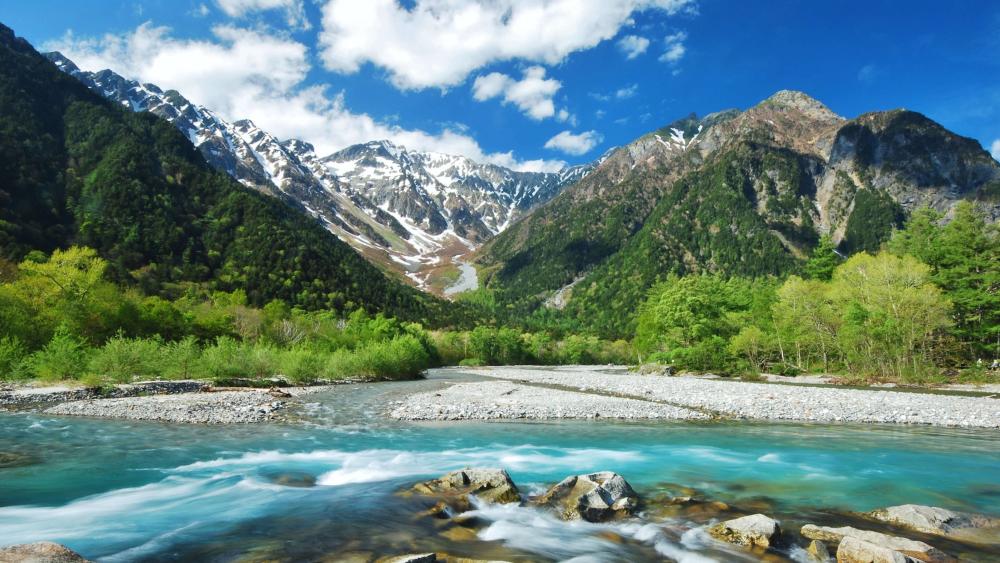 Serenity Amidst Majestic Mountains in Kamikochi Japan wallpaper