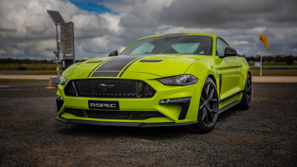 Vibrant Green Mustang on Overcast Day wallpaper