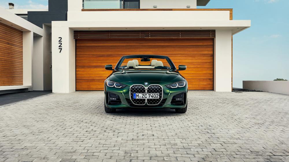 Elegant BMW Convertible Parked in Modern Driveway wallpaper