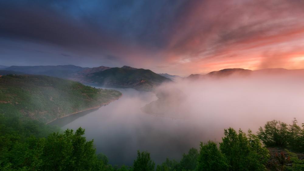 Misty Sunrise Over Serene River wallpaper