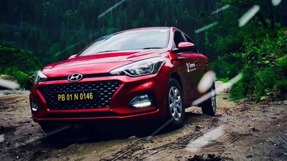 Sleek Adventure Awaits with the Red Hyundai on Trails wallpaper