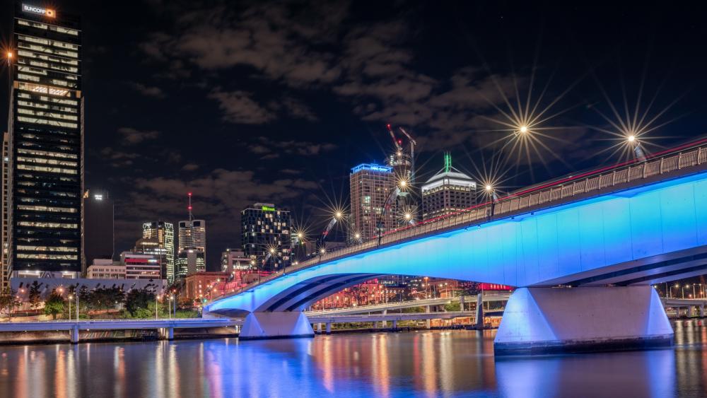 Vivid Night Scene Featuring a Radiant Urban Bridge wallpaper