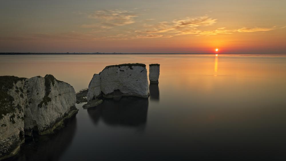 Sunset Over Quiet Sea Stacks and Chalk Cliffs wallpaper