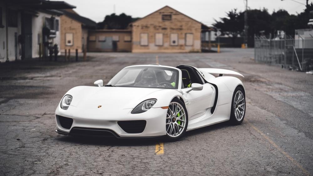White Porsche 918 Spyder Supercar in Industrial Street Setting wallpaper