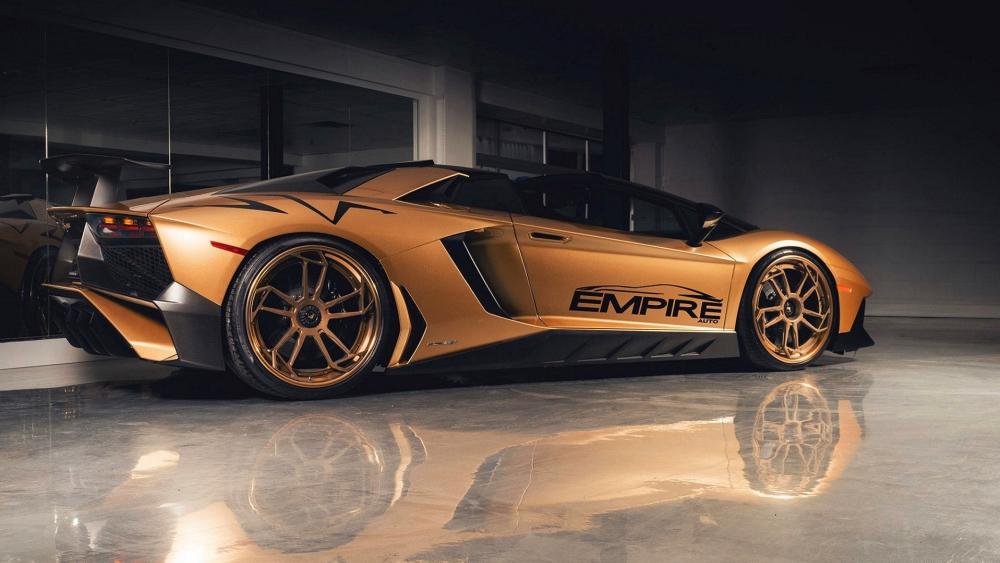 Gold Lamborghini Aventador Under Studio Lights wallpaper