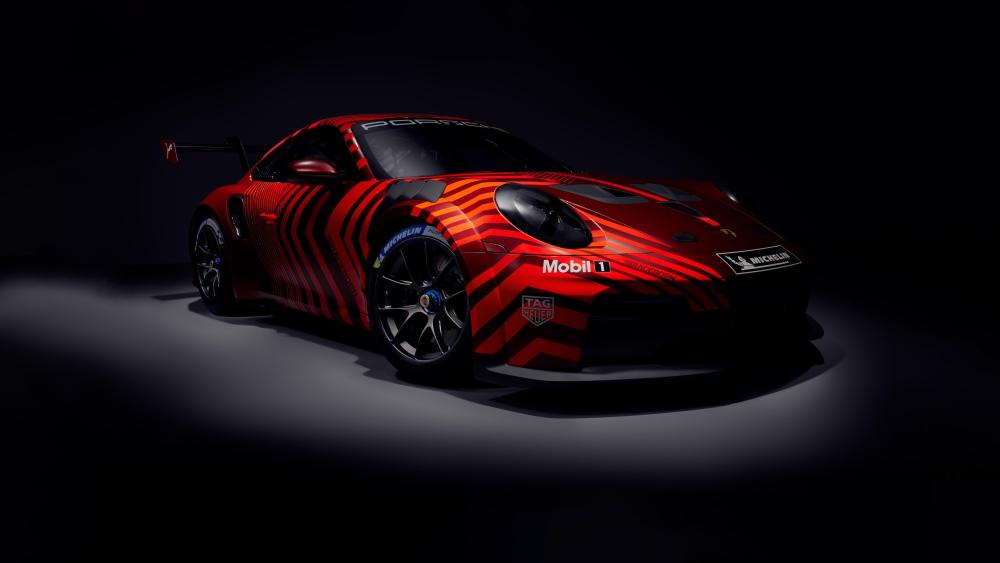 Stealth Red Porsche 911 Cup Under Studio Spotlight 4K Wallpaper wallpaper