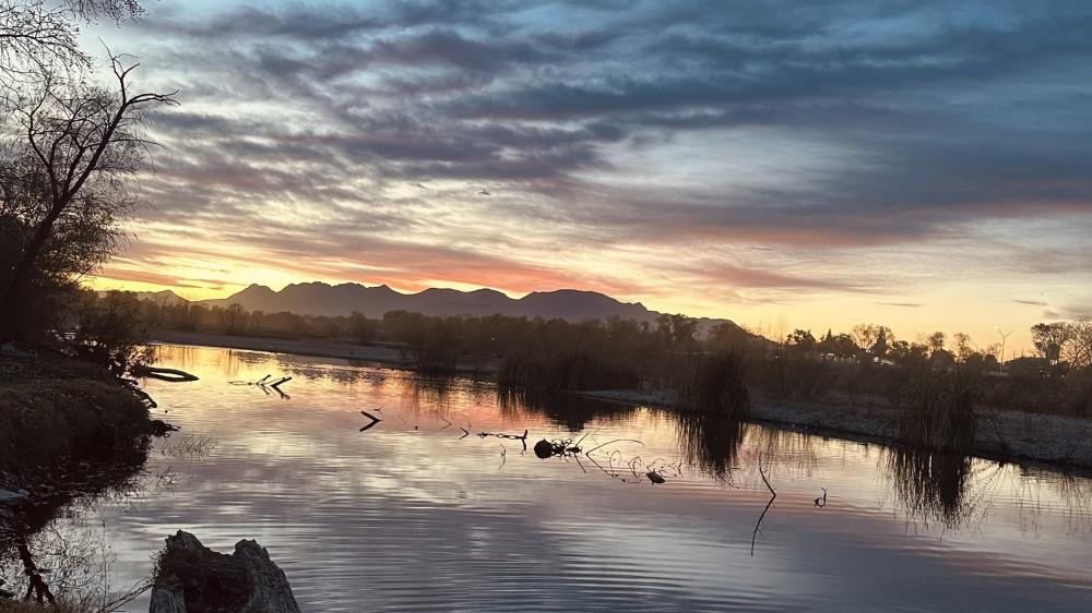 Twilight Reflections Over a Quiet Mexican River and Distant Mountains wallpaper