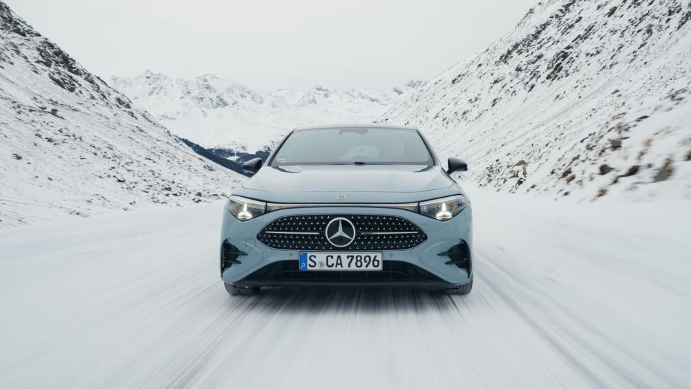 Mercedes-Benz Compact SUV Cutting Through a Snowy Mountain Pass wallpaper