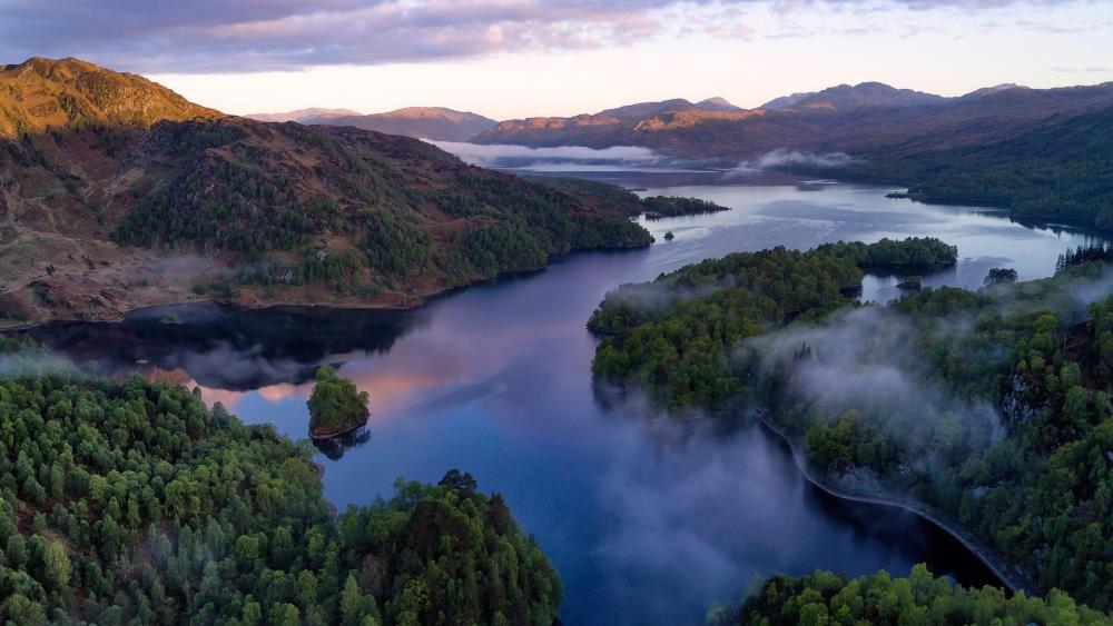 Misty Dawn Over Loch Lomond in the Trossachs National Park wallpaper
