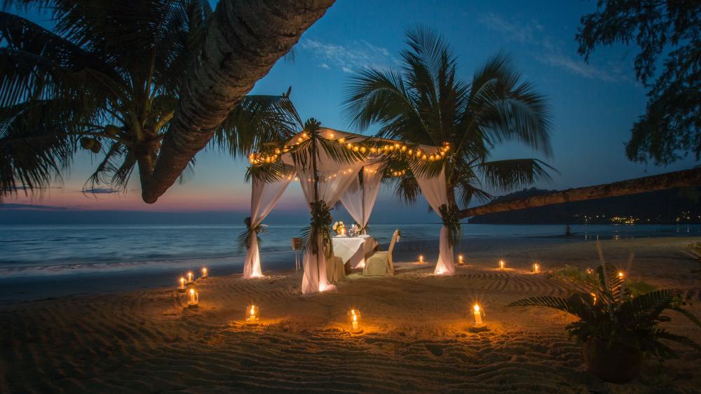 Candlelit Beach Dinner Under Palms at Twilight in Tropical Paradise wallpaper