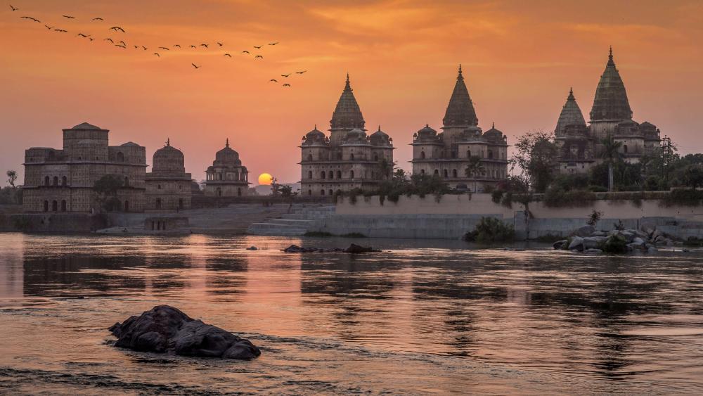 Sunset Over Orchha Temples Along the Betwa River in 4K wallpaper