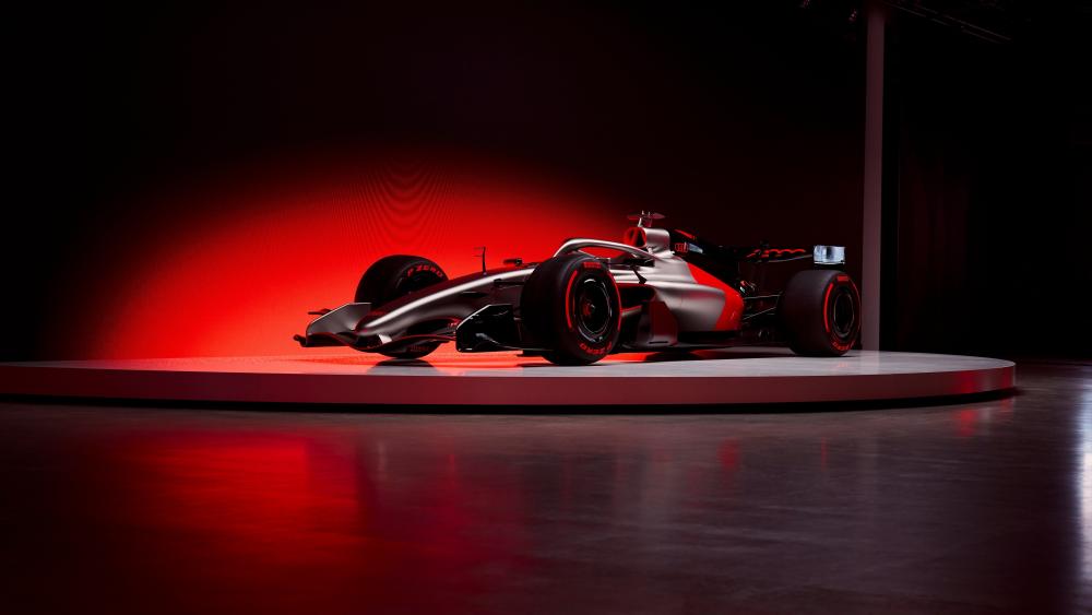 Audi Inspired Formula One Car Under Red Studio Lights wallpaper