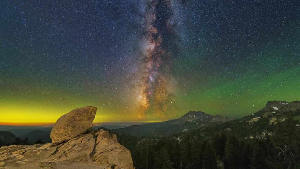 Milky Way Over Mountain Ridge and Lone Rock Under Starry Sky wallpaper