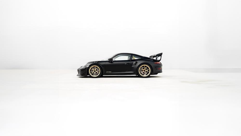 Minimalist Black Porsche 911 GT3 RS on Clean White Background wallpaper