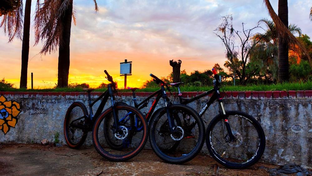 Mountain Bikes Resting at Sunset After an Epic Trail Ride wallpaper