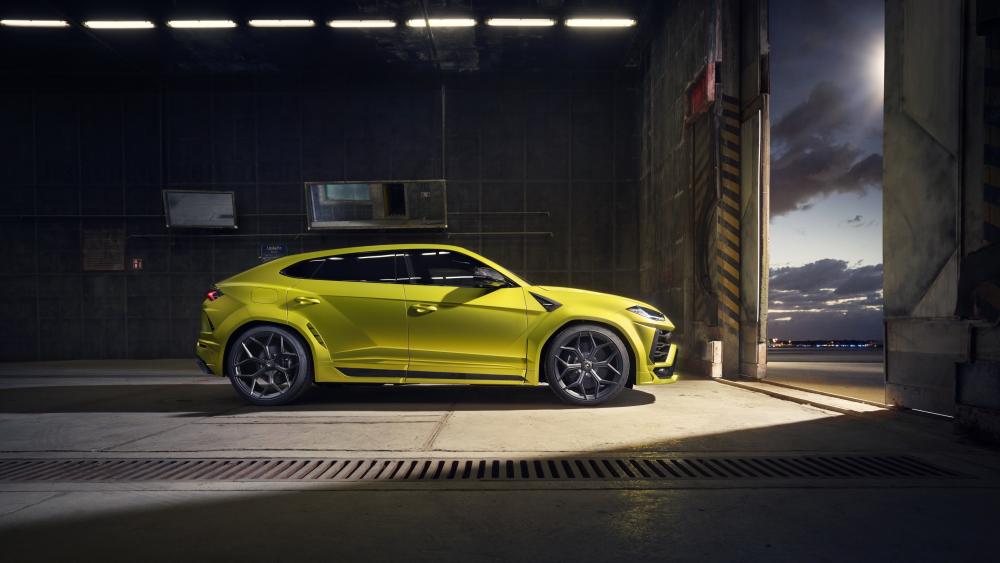 Lamborghini Urus in Neon Yellow Waiting at the Hangar Door wallpaper