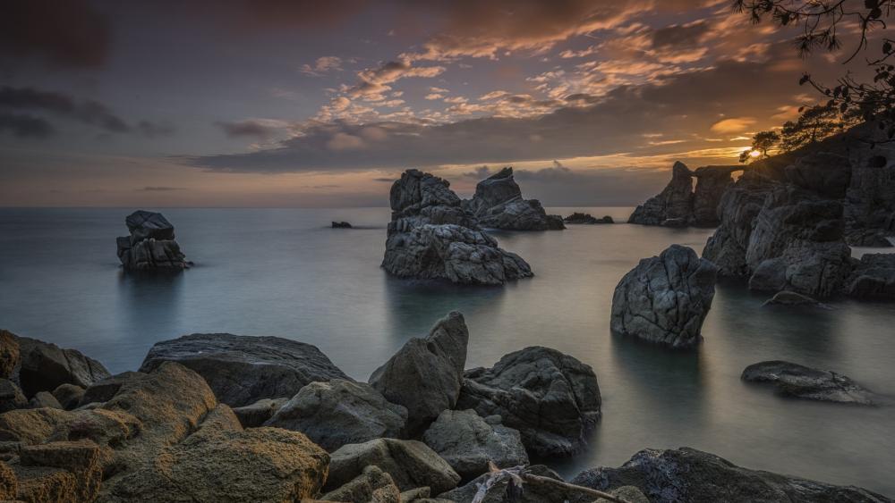 Silent Sea Stacks at Dusk Beneath a Painted Sky wallpaper