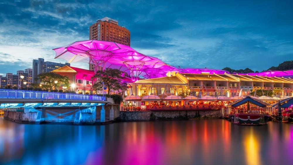 Neon Glow Over Clarke Quay Waterfront in Singapore Night wallpaper