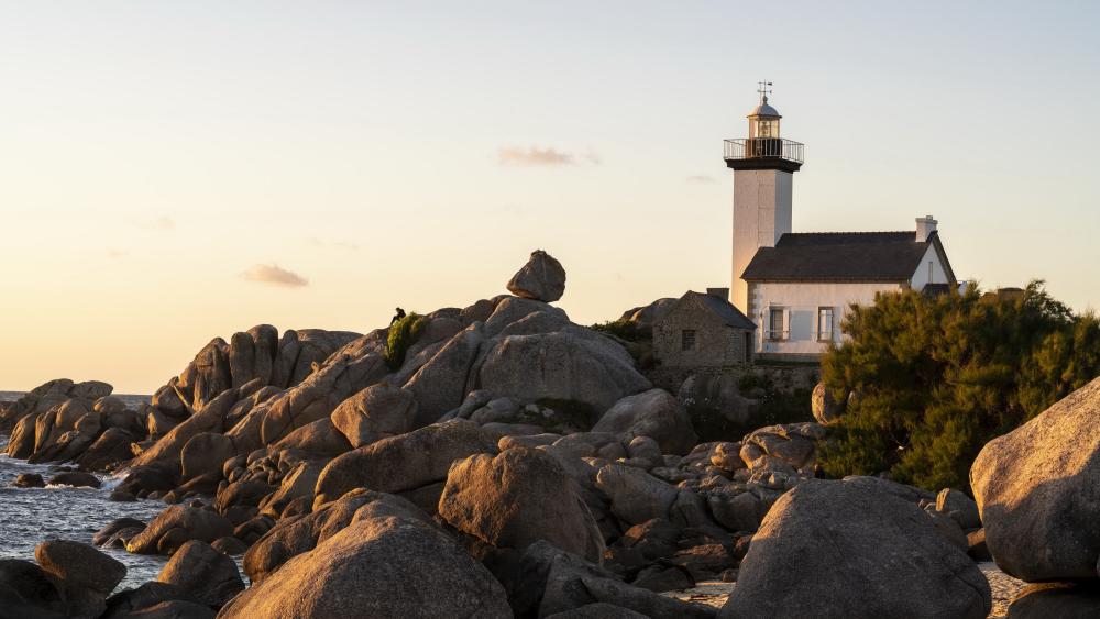 Golden Hour Calm at Pontusval Lighthouse on Brittanys Rocky Coast wallpaper