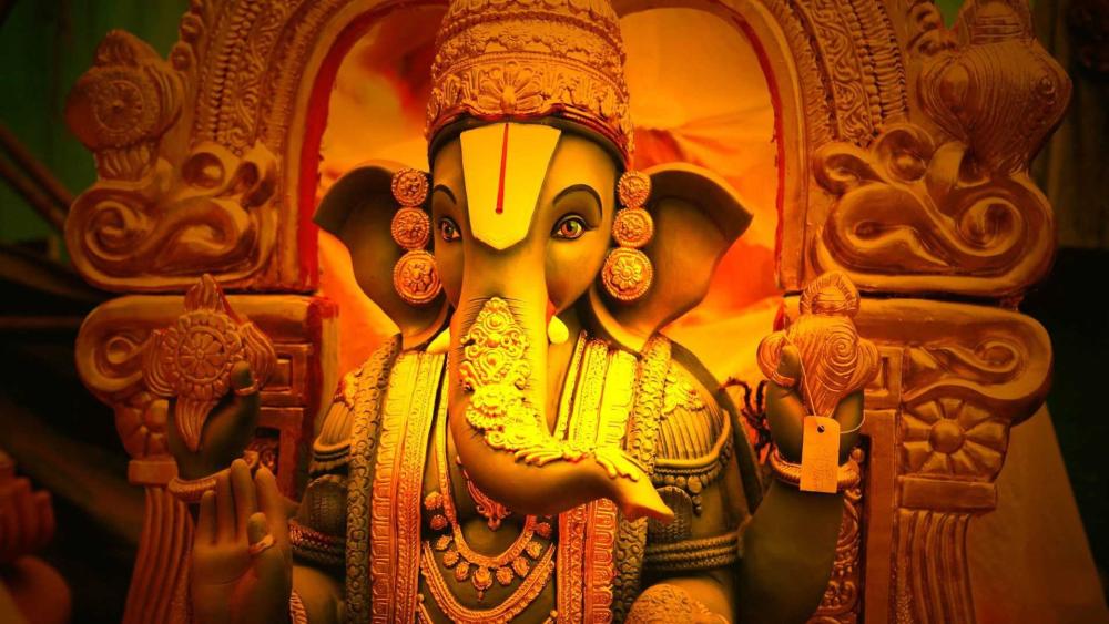Radiant Ganesha in Golden Glow Abstract Hindu Wallpaper wallpaper