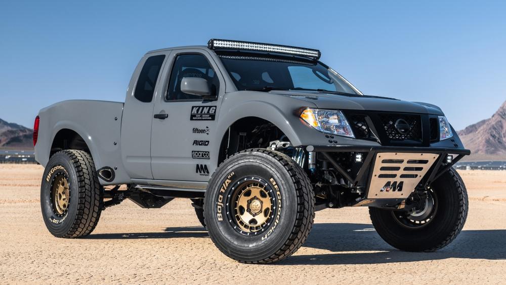 Desert Ready Nissan Frontier Off Road Pickup on Rugged Tires wallpaper