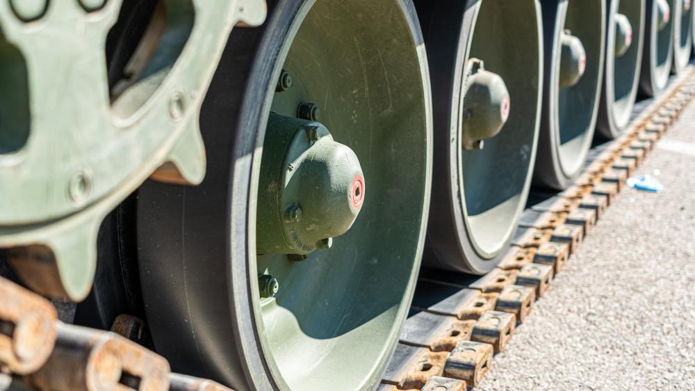 Steel Tracks and Road Wheels Close Up Military Tank Wallpaper wallpaper