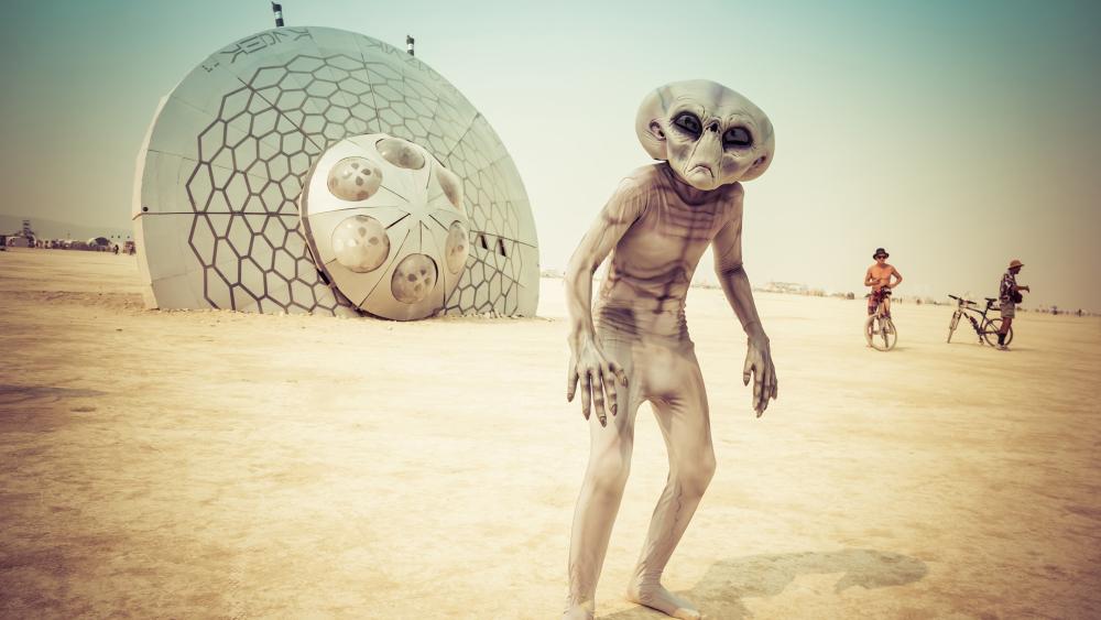 Alien Wanderer at Desert Festival Under a Futuristic Dome wallpaper