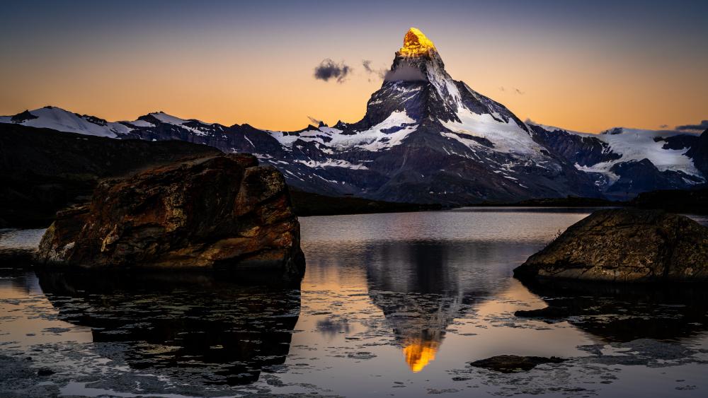 Golden Matterhorn Reflection over Riffelsee at Alpine Twilight wallpaper
