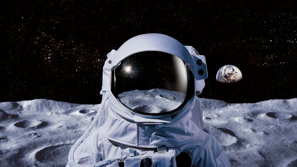 Lone Astronaut on Moon Surface with Earth Rising in Deep Space wallpaper