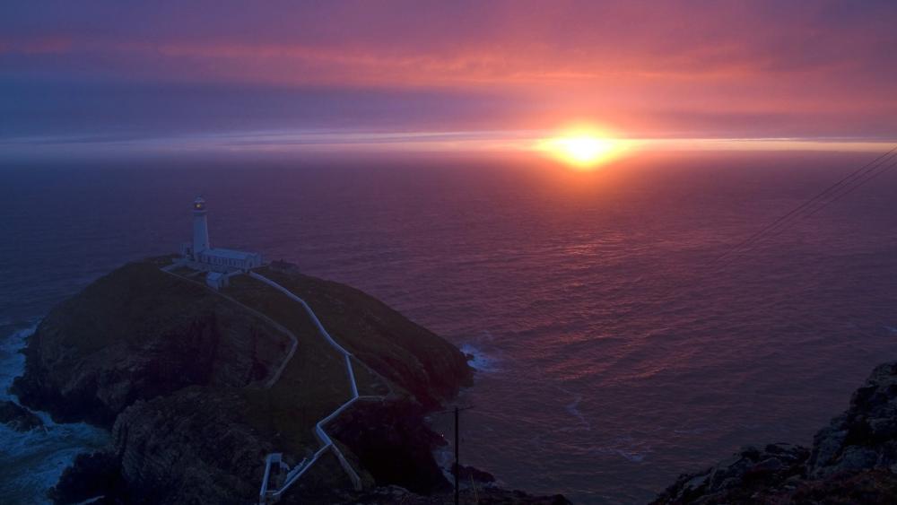 South Stack Lighthouse at Sunset Over the Irish Sea wallpaper