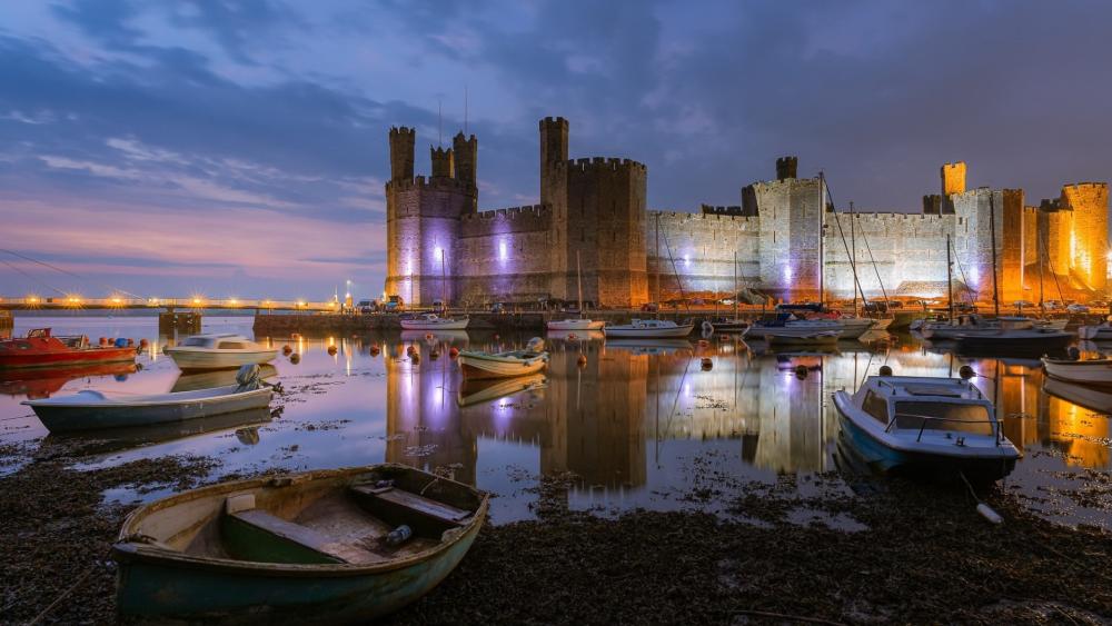 Twilight Reflections at Caernarfon Castle Harbor in Wales wallpaper