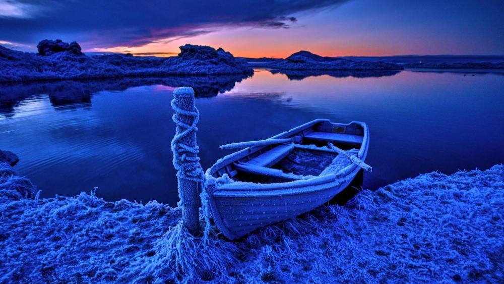 Frozen Boat at Blue Hour on a Silent Winter Lake wallpaper