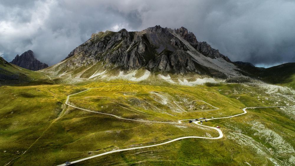 Stormlit Peaks Above Colle Valcavera in Valle Maira Italy wallpaper
