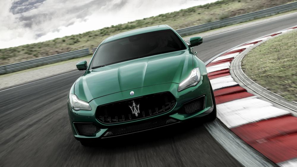 Emerald Maserati Ghibli Racing Through Curves in 5K Luxury Style wallpaper