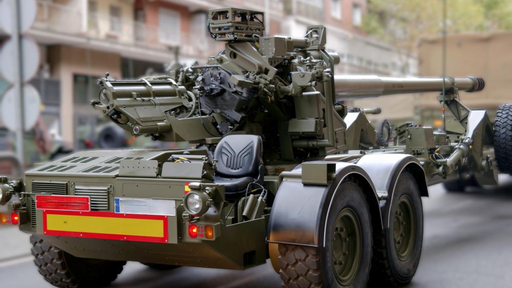 5K Field Artillery Cannon in Urban Street Display wallpaper