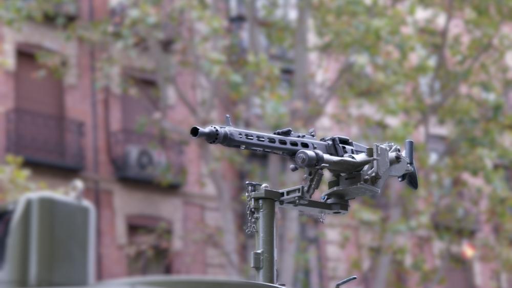 Mounted Heavy Machine Gun Aiming Over Urban Street in 5K Detail wallpaper