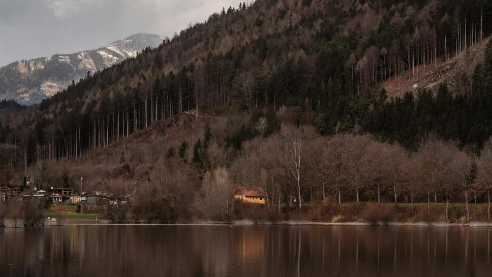 Moody Mountain Lake Reflection Under Soft Overcast Skies wallpaper