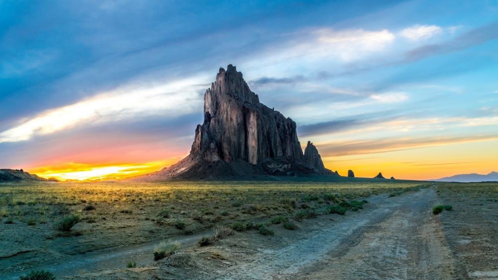 Sunset Over Shiprock Volcanic Spire in New Mexico Wilderness wallpaper