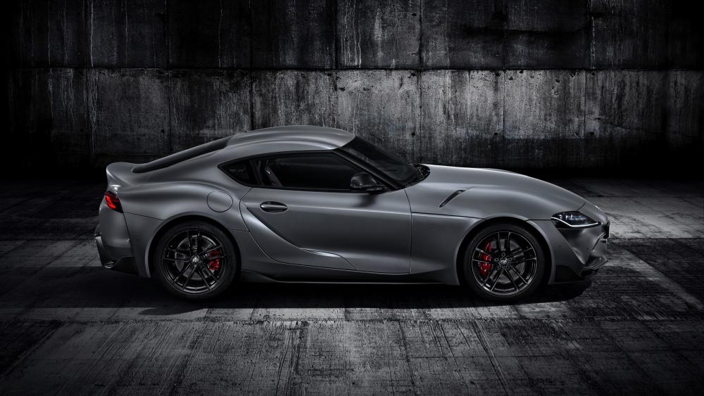 Monochrome Toyota GR Supra Silhouette in a Gritty Urban Garage wallpaper