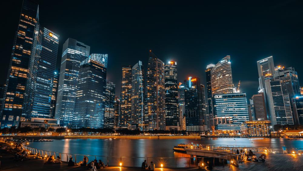 Singapore Skyline at Dusk with Glittering Skyscrapers over the Waterfront wallpaper