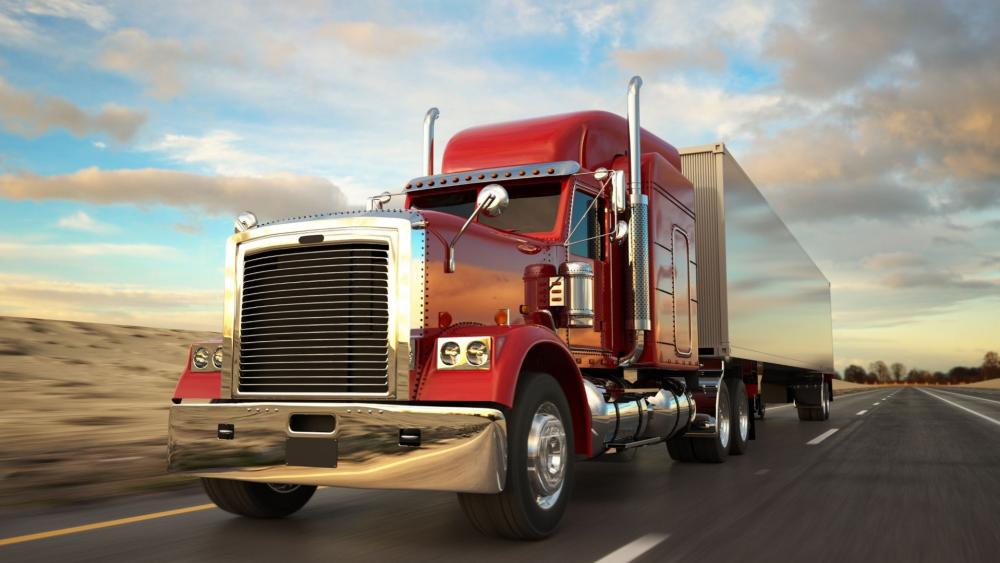 Crimson Semi Trailer Truck Rolling Through Open Highway Skies wallpaper