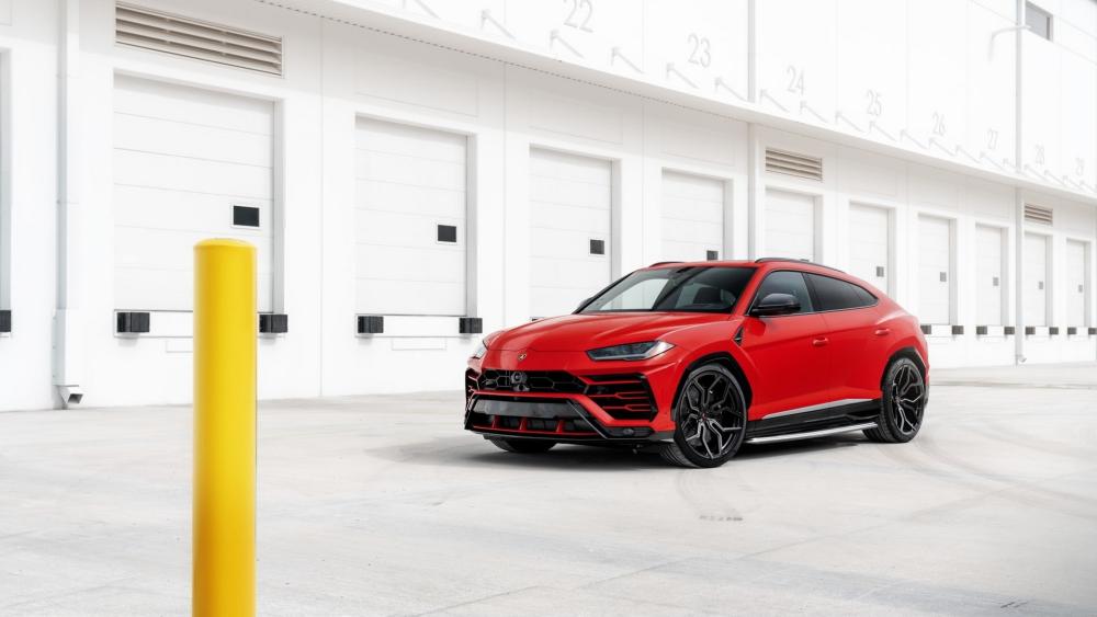 Red Lamborghini Urus in Minimalist Industrial Garage Setting wallpaper