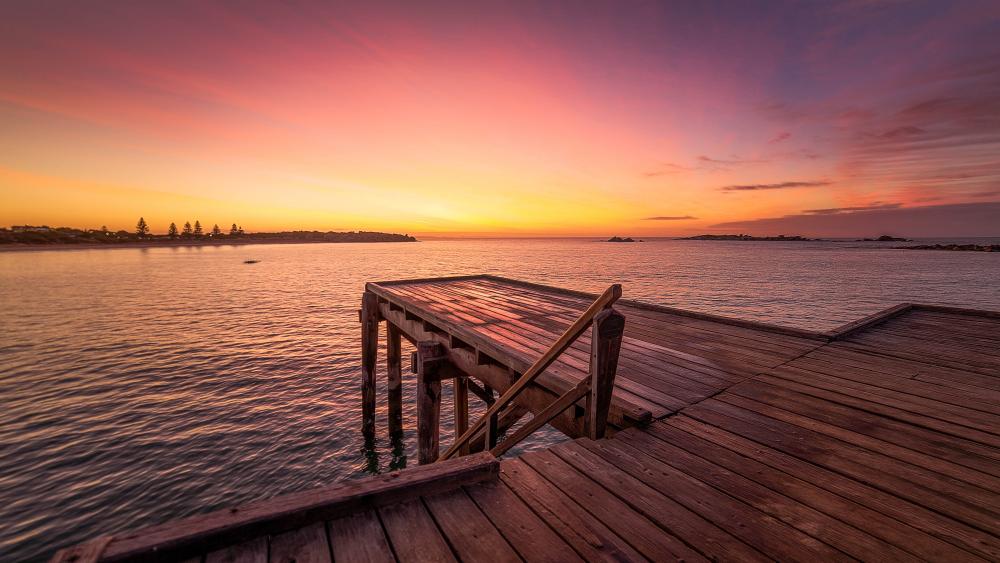 Golden Afterglow Over a Quiet Wooden Pier at Dusk wallpaper