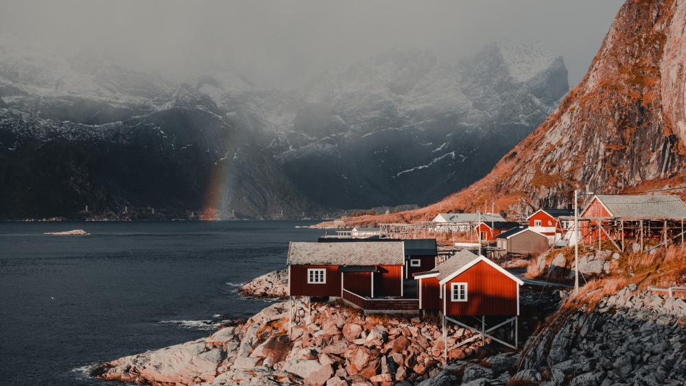 Rainbow Over Lofoten Fjord and Red Cabins in Norway 4K wallpaper