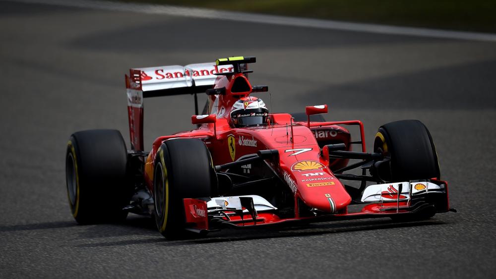 Scarlet Formula One Machine Charging Through a Fast Corner wallpaper