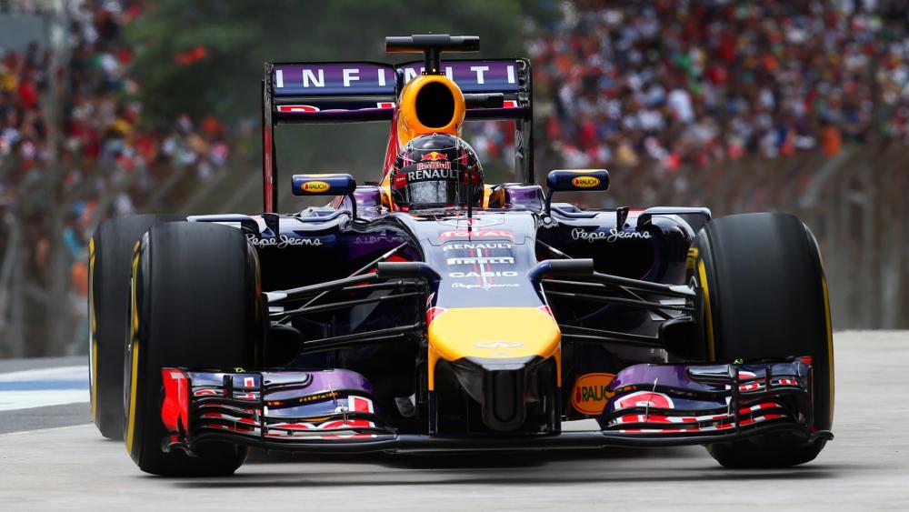 Front View Formula 1 Race Car Powering Through the Circuit wallpaper