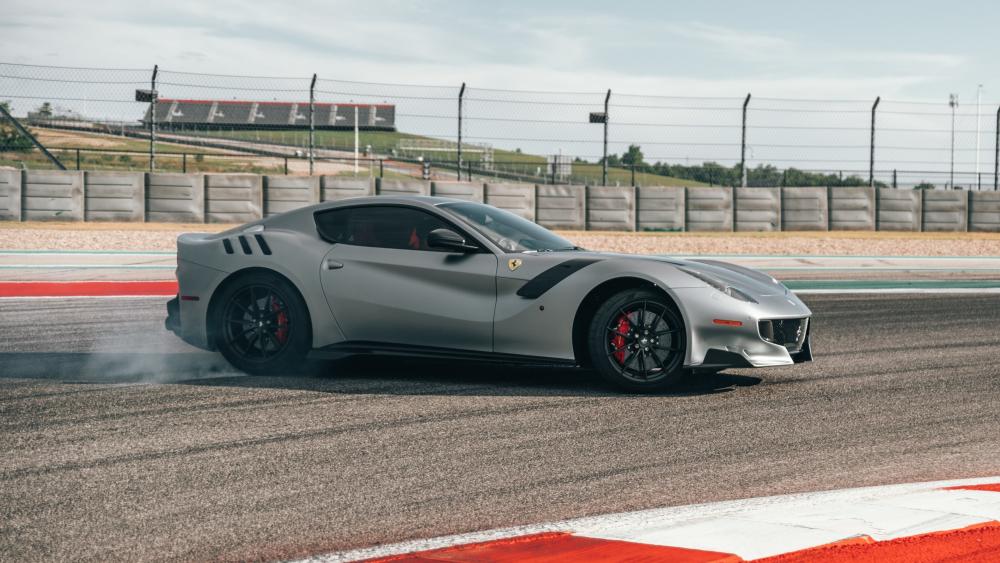 Ferrari F12tdf Trackside Drift in Sleek Silver 4K Wallpaper wallpaper