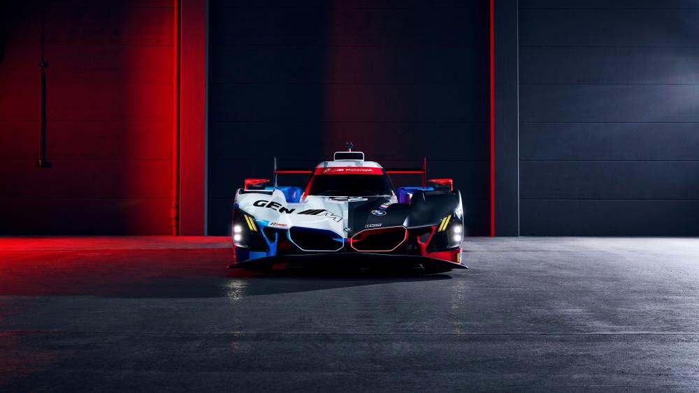 BMW M Hybrid V8 Race Car Under Neon Garage Lights 8K wallpaper